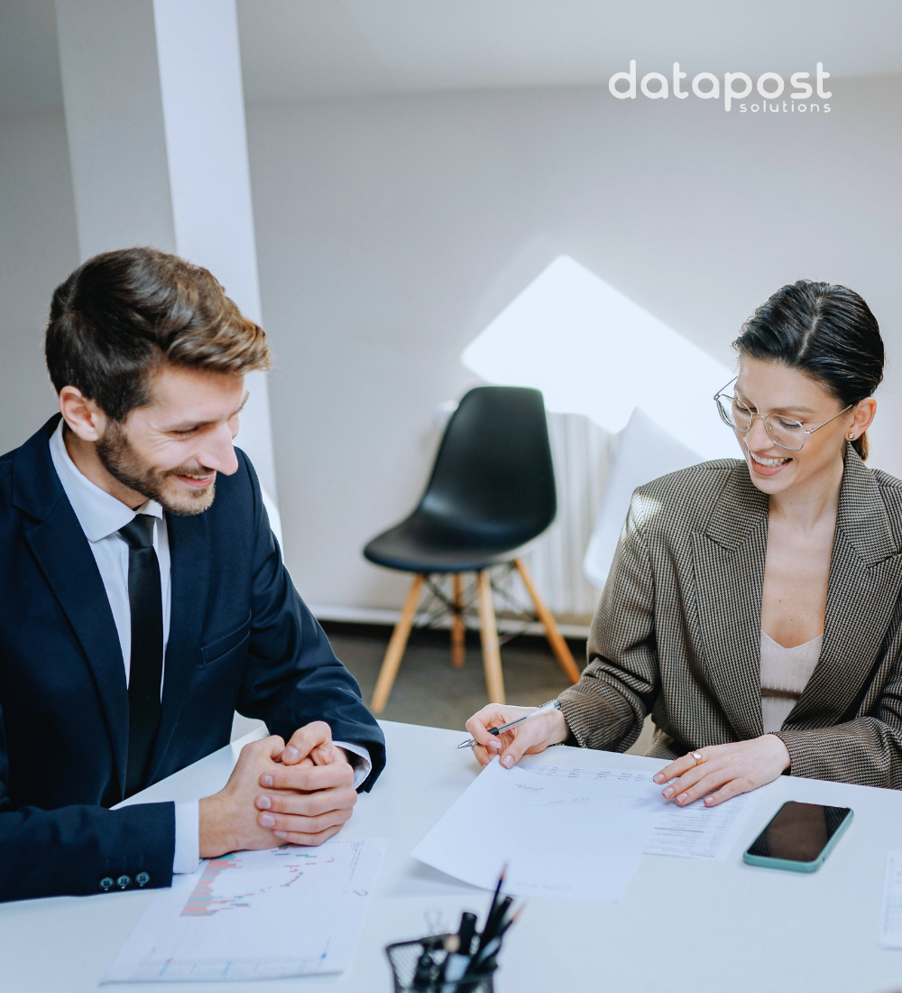 Employees working together to choose the best software for business in a modern office